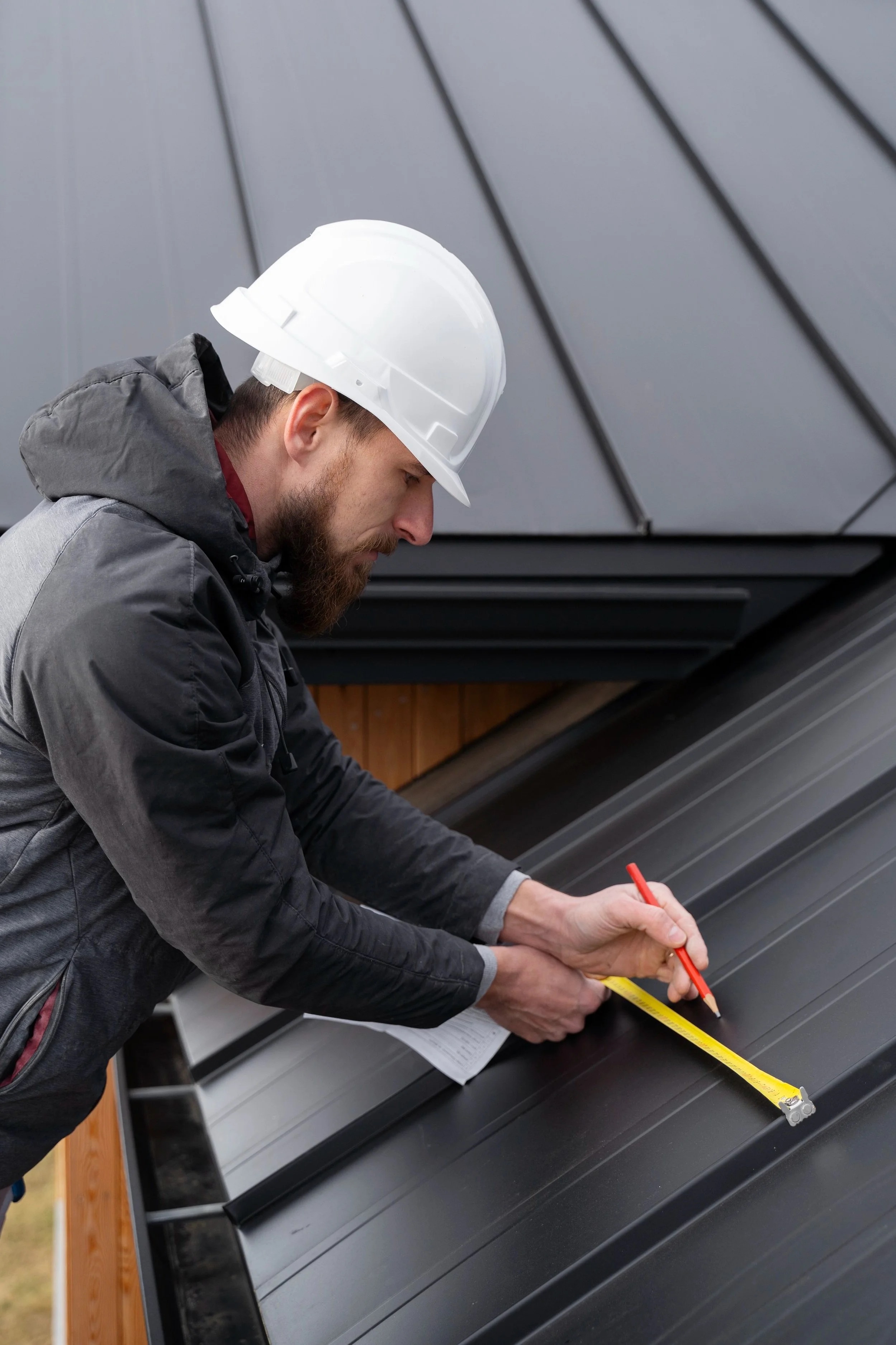 Public adjuster inspecting roof damage